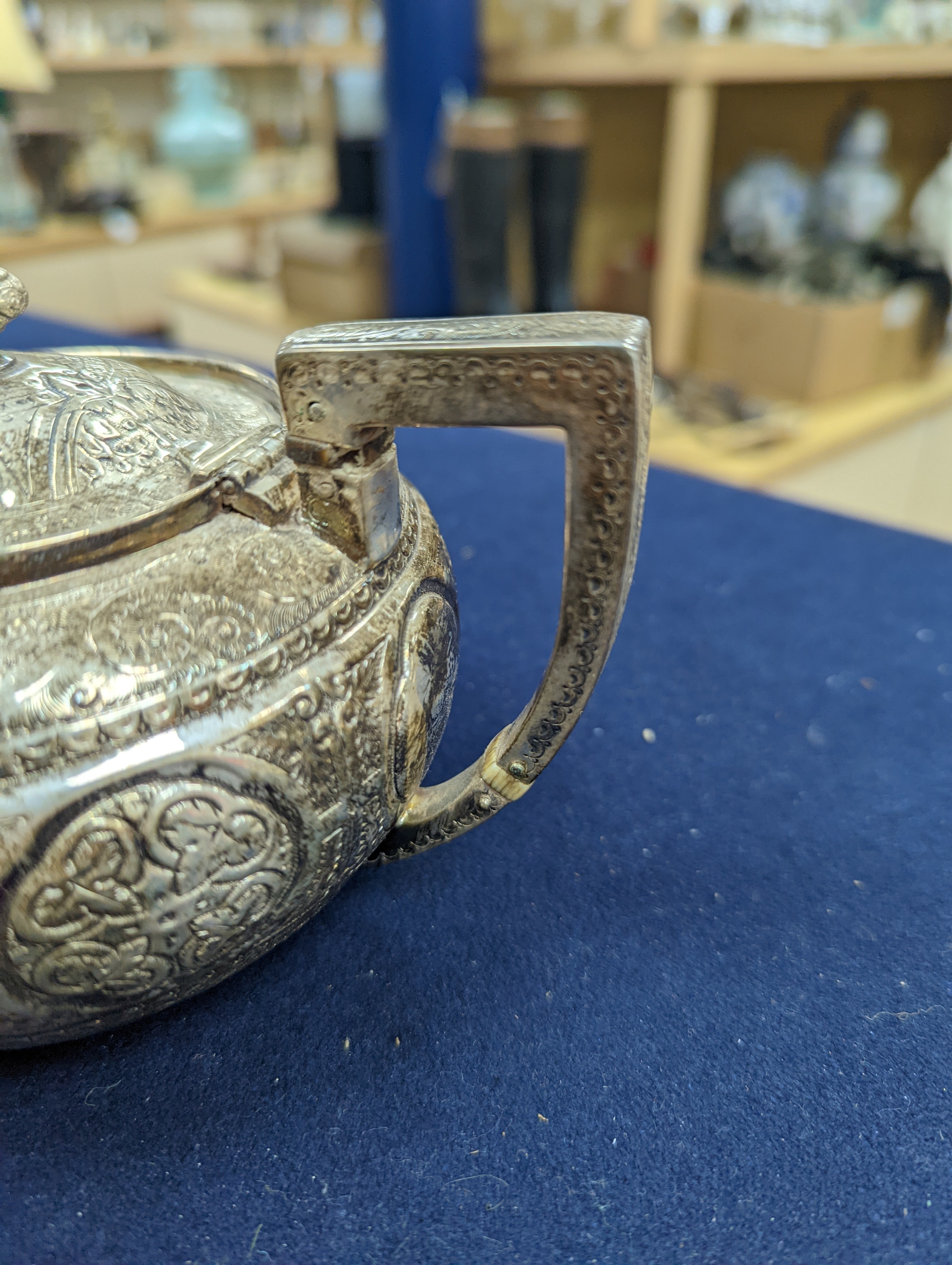A WMF dish, Islamic white metal mounted photo album and a plated teapot and jug